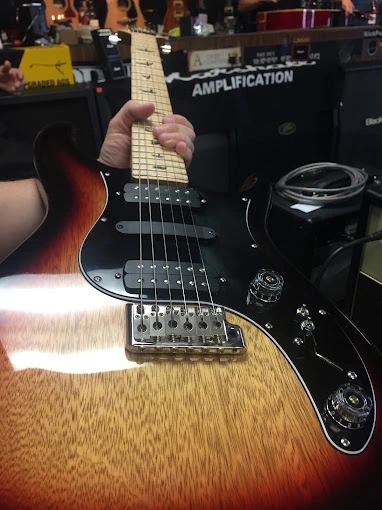 Holding guitar